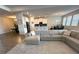 Open-concept living space with wood floors and modern furnishings, ideal for entertaining guests at 2926 Wordsmith Rd, Kissimmee, FL 34746