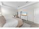 Bright main bedroom featuring neutral colors, desk, and a view to ensuite bathroom at 2926 Wordsmith Rd, Kissimmee, FL 34746