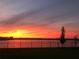 Sunset view over the lake from backyard at 2926 Wordsmith Rd, Kissimmee, FL 34746