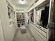 Walk-in closet featuring custom shelving and drawers to maximize storage and organization at 2926 Wordsmith Rd, Kissimmee, FL 34746