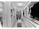 Well-organized walk-in closet with custom shelving, drawers, and ample storage space at 2926 Wordsmith Rd, Kissimmee, FL 34746