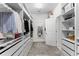 Spacious walk-in closet with custom shelving, drawers, and ample storage space at 2926 Wordsmith Rd, Kissimmee, FL 34746
