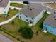 Aerial view showing a house, backyard, and surrounding community at 3033 Beau Loop, Tavares, FL 32778