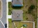 An overhead view of homes displaying their rooftops and backyards from above at 3033 Beau Loop, Tavares, FL 32778