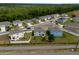 A broader aerial view, showing the residential homes in an established neighborhood at 3033 Beau Loop, Tavares, FL 32778