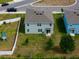A wide shot showing homes in a neighborhood, providing context to its location at 3033 Beau Loop, Tavares, FL 32778