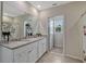 This bathroom has a shower and tub, a toilet, and a vanity sink with granite countertops at 3033 Beau Loop, Tavares, FL 32778