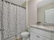 This bathroom features a shower and tub, a toilet, and a vanity sink with granite countertops at 3033 Beau Loop, Tavares, FL 32778