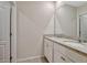 Bathroom with double sinks, granite countertops, and modern fixtures at 3033 Beau Loop, Tavares, FL 32778