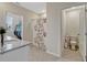 This bathroom has a shower and tub, a toilet, and a vanity sink with granite countertops at 3033 Beau Loop, Tavares, FL 32778