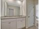 Bathroom featuring dual sinks with granite countertops and modern vanity at 3033 Beau Loop, Tavares, FL 32778
