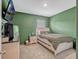 This bedroom features plush carpet, pale trim, and a comfy-looking bed with thick bedding at 3033 Beau Loop, Tavares, FL 32778