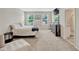 This bedroom has carpet flooring, a television, and windows that provide plenty of natural light at 3033 Beau Loop, Tavares, FL 32778