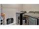 Laundry room featuring modern black Samsung washer and dryer at 3033 Beau Loop, Tavares, FL 32778