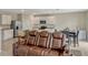 Comfortable living room features a large leather sofa and entertainment area with a cozy rug, perfect for relaxation at 3033 Beau Loop, Tavares, FL 32778