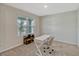 Bright office space featuring natural light from a large window, neutral carpet and a modern desk at 3033 Beau Loop, Tavares, FL 32778