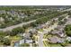 A residential neighborhood featuring mature trees, private pools, sidewalks, and well-manicured lawns at 3137 Timucua Cir, Orlando, FL 32837