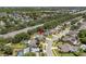 A residential neighborhood featuring mature trees, private pools, sidewalks, and well-manicured lawns at 3137 Timucua Cir, Orlando, FL 32837