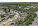 A high aerial view of the home in a residential neighborhood with mature landscaping at 3137 Timucua Cir, Orlando, FL 32837