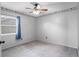 Neutral bedroom with gray carpet flooring, white walls, and a Patriots-themed wallpaper border at 3137 Timucua Cir, Orlando, FL 32837