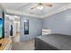 Bedroom with ceiling fan, grey walls, and closet at 3137 Timucua Cir, Orlando, FL 32837