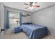 Cozy bedroom with a ceiling fan, a sunny window, and a classic blue color scheme at 3137 Timucua Cir, Orlando, FL 32837
