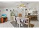 Open dining room with elegant display cabinet, tile flooring and views into other rooms in the house at 3137 Timucua Cir, Orlando, FL 32837