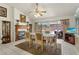 Dining area with views of the pool, showcasing a decorative fireplace and comfortable seating for Gathering meals at 3137 Timucua Cir, Orlando, FL 32837