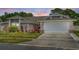 Charming single-story home with well-maintained landscaping and an attached two-car garage at 3137 Timucua Cir, Orlando, FL 32837