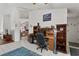 A cozy home office area featuring built-in shelving and a comfortable workspace in the living area at 3137 Timucua Cir, Orlando, FL 32837