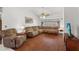 Spacious living room with hardwood floors, ample seating, and large windows providing natural light at 3137 Timucua Cir, Orlando, FL 32837