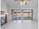 Spacious living room featuring a fireplace and backyard pool views at 3137 Timucua Cir, Orlando, FL 32837