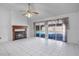 The living room features a fireplace, tile flooring, and sliding glass doors to the pool at 3137 Timucua Cir, Orlando, FL 32837