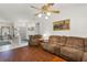 Open-concept living room with hardwood floors, comfortable seating, and a bright, airy atmosphere at 3137 Timucua Cir, Orlando, FL 32837