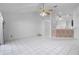 Bright living room with tile floors and a view of the bar, closet and a glimpse of the kitchen at 3137 Timucua Cir, Orlando, FL 32837