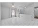 Bright living room with tiled flooring, ceiling fan, and window overlooking the front yard at 3137 Timucua Cir, Orlando, FL 32837