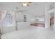 Spacious room showcasing a combination of tiled and wood laminate flooring and abundant natural light at 3137 Timucua Cir, Orlando, FL 32837