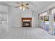 Bright living room with a fireplace and sliding doors to the pool at 3137 Timucua Cir, Orlando, FL 32837