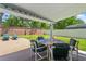 Outdoor covered patio with seating area and colorful string lights, perfect for entertaining at 3137 Timucua Cir, Orlando, FL 32837