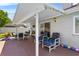 Covered patio space with ample seating, ideal for relaxing and enjoying the outdoors at 3137 Timucua Cir, Orlando, FL 32837