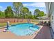 A private backyard pool with a patio area, outdoor seating, and a basketball hoop for fun at 3137 Timucua Cir, Orlando, FL 32837