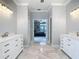 Bathroom with dual vanities, a soaking tub, a walk in shower and tile floors at 3534 Woodley Park Pl, Oviedo, FL 32765