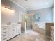 This bathroom features a walk in shower, soaking tub, and and vanities at 3534 Woodley Park Pl, Oviedo, FL 32765
