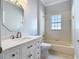 Traditional bathroom with decorative mirror, white marble counters, and tub shower combo at 3534 Woodley Park Pl, Oviedo, FL 32765