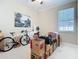 Neutral bedroom featuring a ceiling fan, window, and white carpet at 3534 Woodley Park Pl, Oviedo, FL 32765