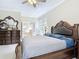 Bedroom featuring dark wood furniture, crown molding, and french doors to the outside at 3534 Woodley Park Pl, Oviedo, FL 32765