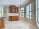 Breakfast nook featuring custom wood cabinets, granite countertops, and views of the yard at 3534 Woodley Park Pl, Oviedo, FL 32765
