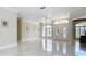 Large foyer featuring marble flooring, columns, high ceilings, and decorative lighting adding a touch of elegance at 3534 Woodley Park Pl, Oviedo, FL 32765