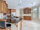 Spacious kitchen featuring granite countertops, stainless steel appliances, and custom cabinetry at 3534 Woodley Park Pl, Oviedo, FL 32765