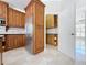 Well-equipped kitchen showcases stainless steel fridge, custom cabinets, and walk-in pantry at 3534 Woodley Park Pl, Oviedo, FL 32765